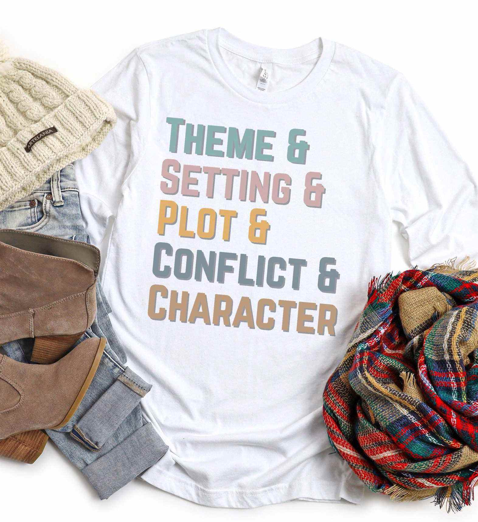 Image d'un t-shirt blanc qui indique "thème & cadre & intrigue & conflit & personnage" aux couleurs pastel. 