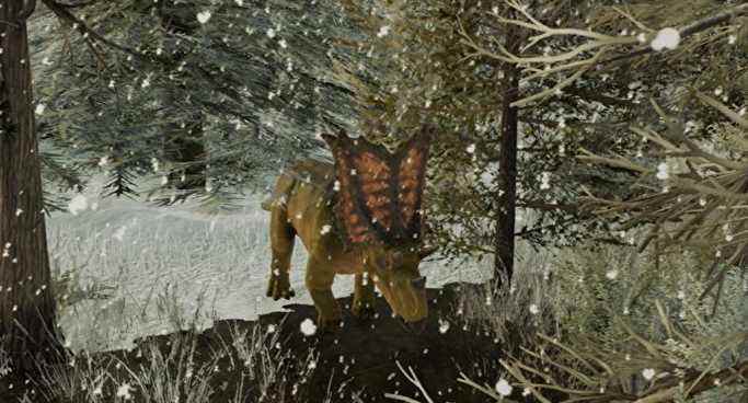 Un tricératops dans Jurassic World Evolution 2, marchant majestueusement dans une forêt de pins enneigée