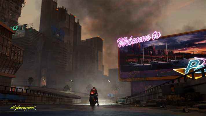 Un personnage conduit une moto dans une rue vacante de Cyberpunk 2077. 