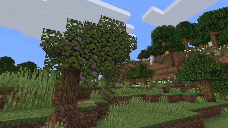 Les azalées mènent aux grottes luxuriantes de Minecraft ci-dessous.  Ils ont des fleurs lilas distinctives sur leurs feuilles.