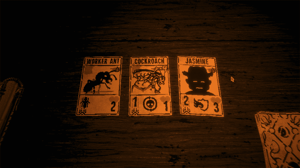 Trois cartes sont posées sur une table en bois : une étiquetée fourmi ouvrière, une étiquetée cafard et une étiquetée Jasmin.