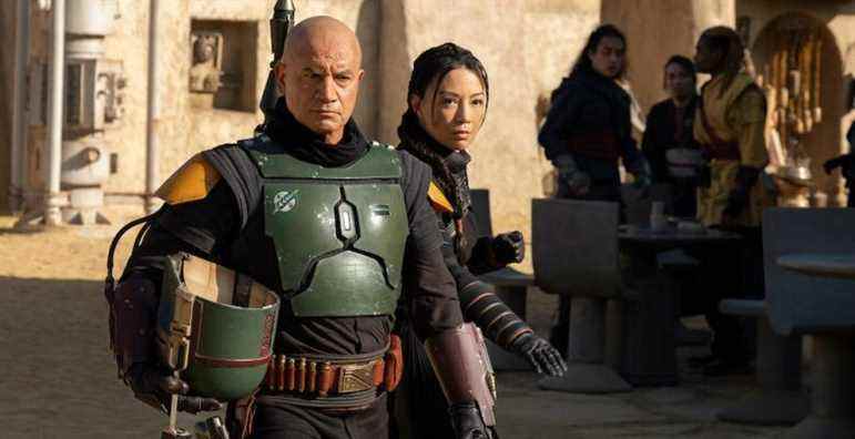 (L-R): Boba Fett (Temura Morrison) and Fennec Shand (Ming-Na Wen) in Lucasfilm's THE BOOK OF BOBA FETT, exclusively on Disney+. © 2021 Lucasfilm Ltd. & ™. All Rights Reserved.