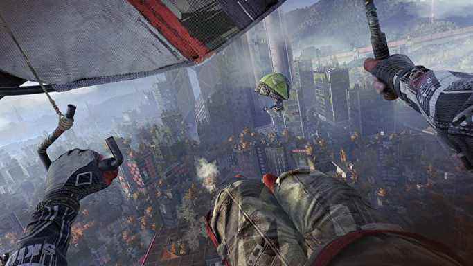 Le joueur fait du deltaplane à travers un paysage urbain parsemé d'arbres dans Dying Light 2