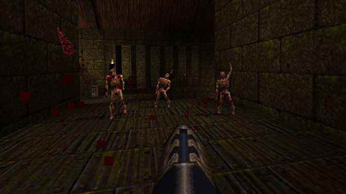Trois zombies s'approchent du joueur dans Quake