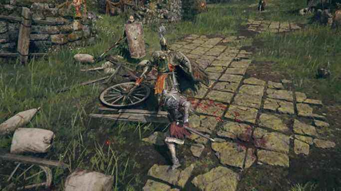 Le joueur poignarde un mort-vivant avec une grosse épée dans Elden Ring.