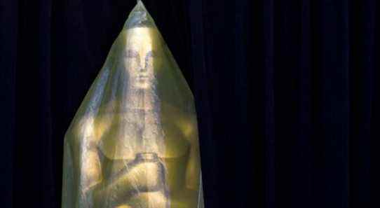 Covered in plastic, an Oscar statue