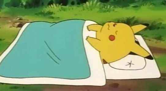 Pikachu sleeping under a blanket in the Pokemon anime