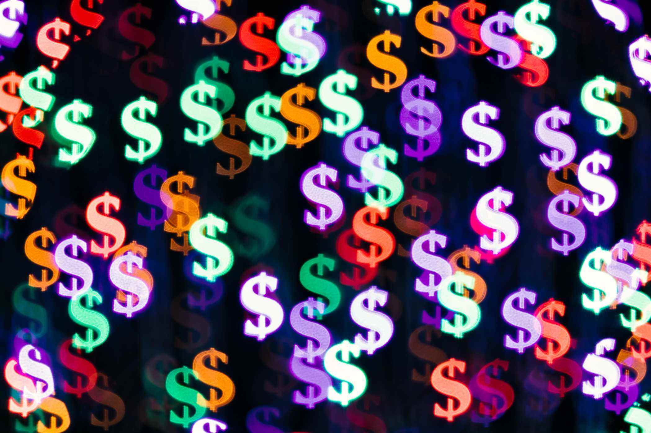 Multicolore Bling Bling Dollar Sign forme Bokeh toile de fond sur fond sombre, Finance Concept.