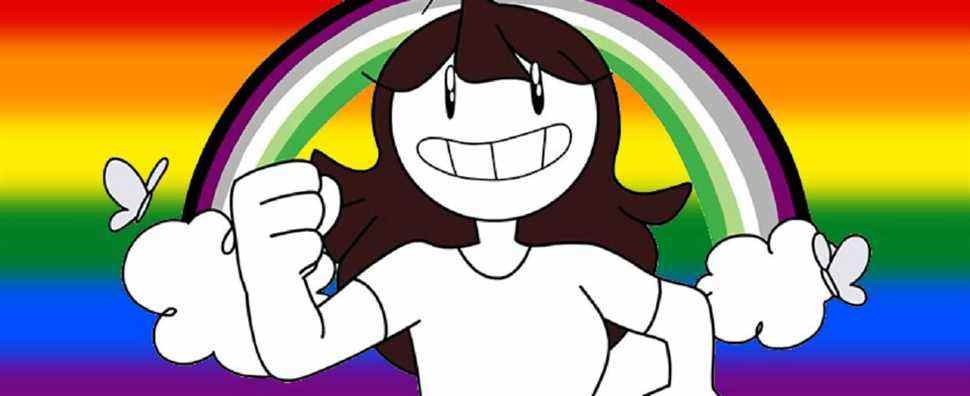 Jaiden animations in front of an LGBT flag background and a rainbow