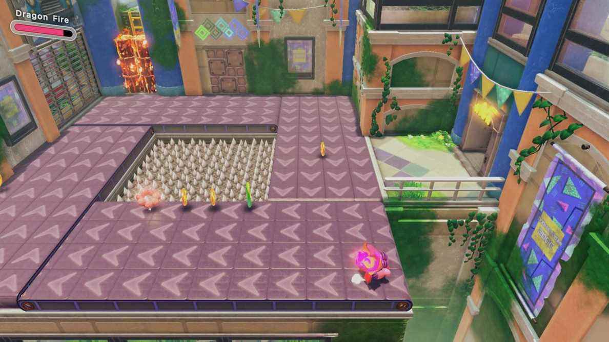 Kirby se tient sur un tapis roulant tandis que des beignets et des pièces flottent autour