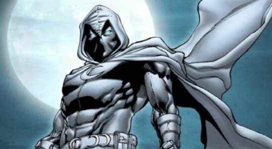 Moon Knight standing in front of the moon in his signature outfit