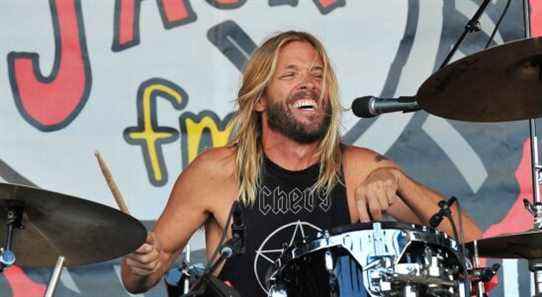 Foo Fighters Taylor Hawkins playing smile