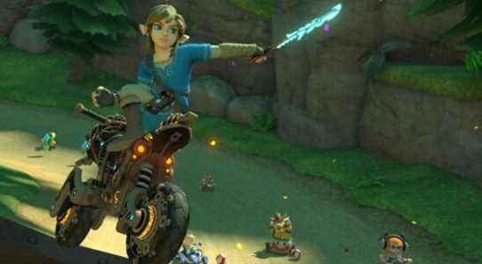 Link holding a Guardian Sword in a Mario Kart 8 Deluxe race, with Rosalina, Bowser, and an Inkling in the background