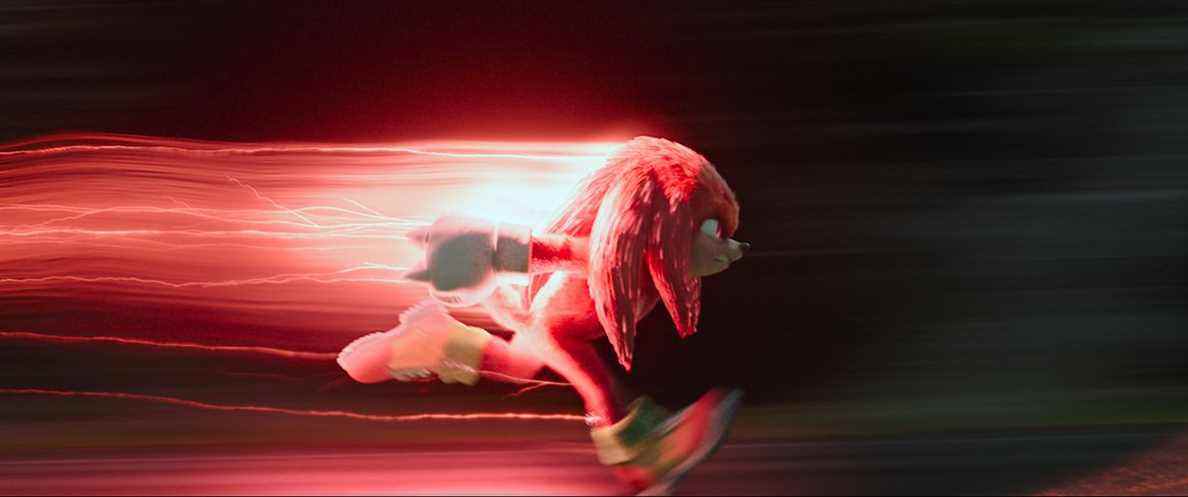jointures en cours d'exécution dans le film Sonic 2.  il y a une traînée de lumière rouge qui le suit