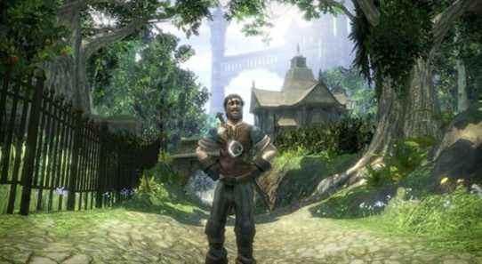A Fable 2 protagonist standing on a paved woodland road with a city in the background