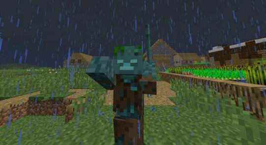 A Drowned zombie standing in a Minecraft village during a rainy night