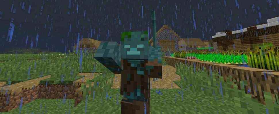 A Drowned zombie standing in a Minecraft village during a rainy night