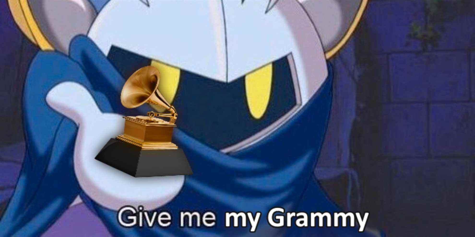 Meta Knight tient un Grammy dans sa paume droite.  La légende se lit comme suit : 