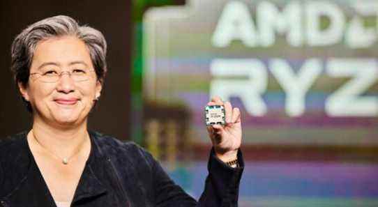 Lisa Su of AMD holding up a Ryzen CPU.