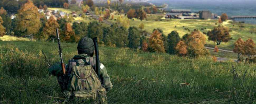 Image from DayZ showing a player sitting down peacefully on a grassy hill.