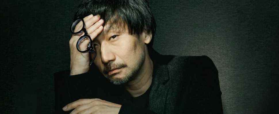 Photo of Hideo Kojima with his head in his hand.