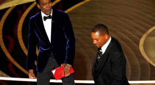 Presenter Chris Rock, left, reacts after Will Smith slapped him onstage during the 94th Academy Awards at the Dolby Theatre, Sunday, March 27, 2022, in Los Angeles. (AP Photo/Chris Pizzello)