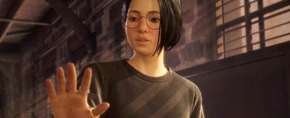 Alex Chen from Life Is Strange: True Colors looking at her hand in wonder