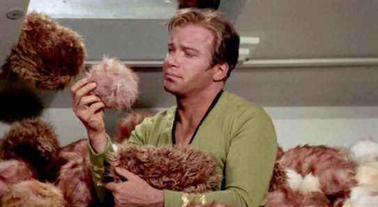 Captain Kirk holding a Tribble