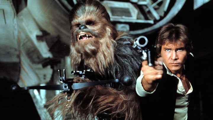 Chewbacca et Han Solo pointant des fusils.