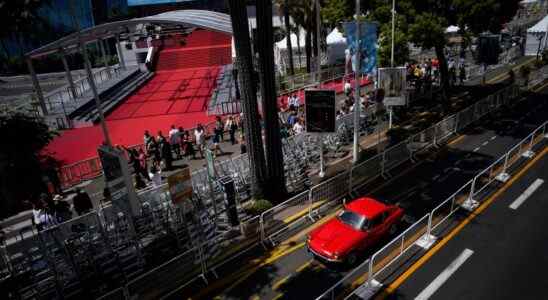 Vintage car drives along the croisette during the 75th international film festival, Cannes, southern France, Saturday, May 21, 2022. (AP Photo/Daniel Cole)