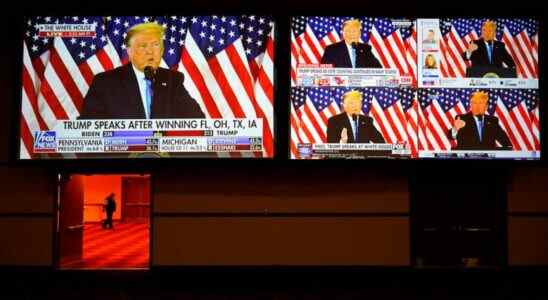 A live broadcast of President Donald Trump speaking from the White House is shown on screens at an election night party, Tuesday, Nov. 3, 2020, in Las Vegas. (AP Photo/John Locher)