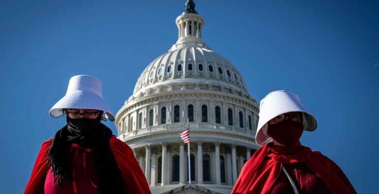 Abortion rights activists costumed after Margaret Atwood's "The Handmaid's Tale" protest outside the U.S. Capitol in Washington, D.C. on Nov. 27, 2021. The Supreme Court will hear arguments on Dec. 1 in a Mississippi bid to have the landmark Roe v. Wade decision overturned, sparking outcry from women's advocacy groups. (Photo by Alejandro Alvarez/Sipa USA)(Sipa via AP Images)