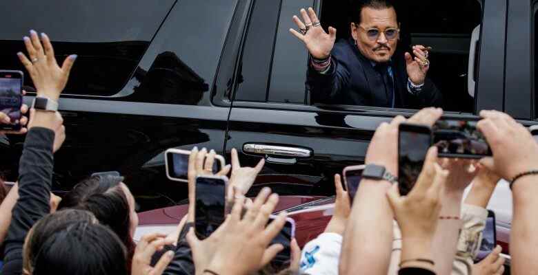 U.S. actor Johnny Depp waves to fans as he leaves the Fairfax Circuit Court on May 26, 2022, in Fairfax, Va. The jury has entered deliberations in the defamation lawsuit filed by U.S. actor Johnny Depp against his former wife, U.S. actress Amber Heard, after she wrote an op-ed in The Washington Post in 2018 that, without naming Depp, accused him of domestic abuse. (Photo by Samuel Corum/Sipa USA)(Sipa via AP Images)