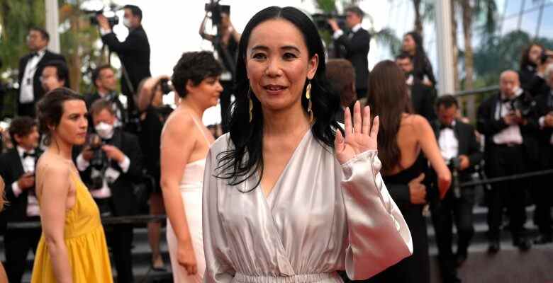 Naomi Kawase poses for photographers upon arrival at the premiere of the film 'Broker at the 75th international film festival, Cannes, southern France, Thursday, May 26, 2022. (AP Photo/Petros Giannakouris)