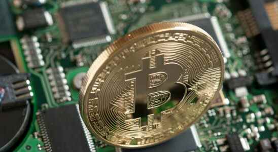 Image of a physical Bitcoin on a PCB.