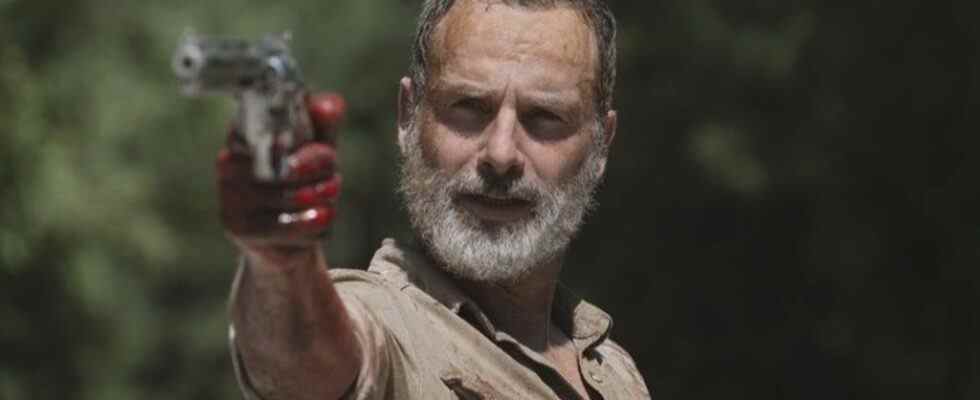 Rick Grimes holding a gun in The Walking Dead