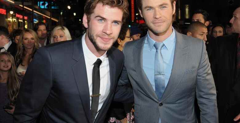 Liam Hemsworth, left, and Chris Hemsworth arrive at the U.S. premiere of "Thor: The Dark World" at the El Capitan Theatre on Monday, Nov. 4, 2013, in Los Angeles. (Photo by John Shearer/Invision/AP)