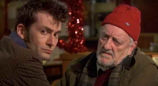 David Tennant sitting somberly with Bernard Cribbins in a cafe in Doctor Who.