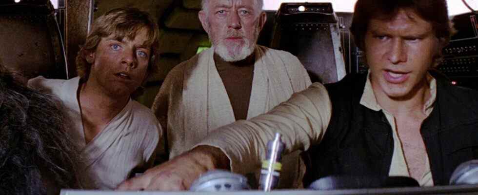 Mark Hamill, Alec Guinness and Harrison Ford in Star Wars Millennium Falcon cockpit