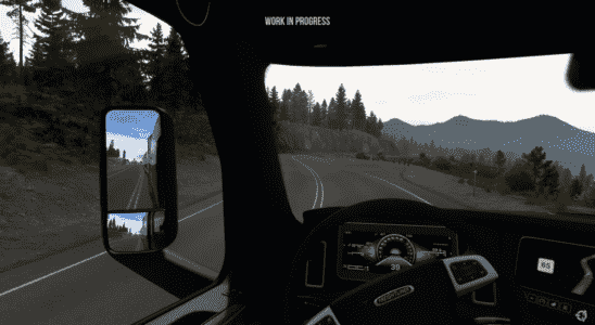 American Truck Simulator Montana a view from the truck cab as it rounds a curve in the mountains.