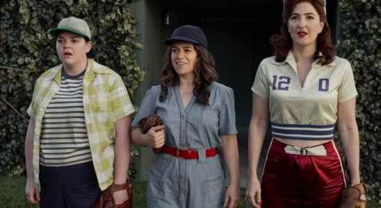Three women in 1940s-era athletic clothing, holding baseball mitts; still from "A League of Their Own."