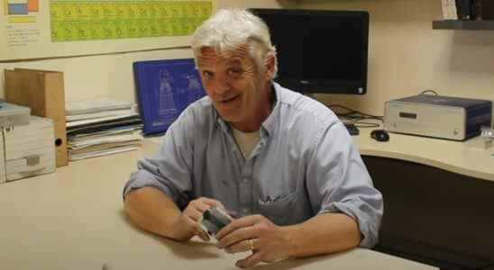 Robert Murray-Smith showing off the paper battery he