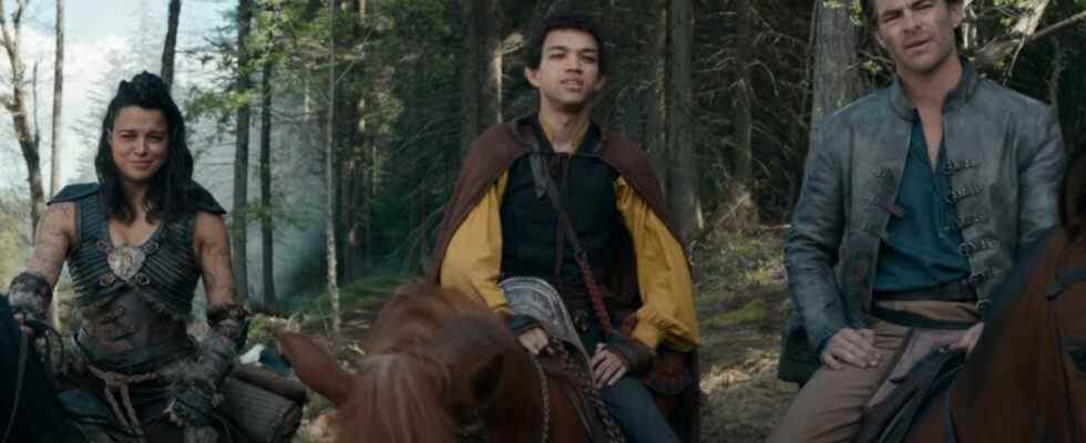 Michelle Rodriguez, Justice Smith, and Chris Pine having a conversation in the woods, on horseback in Dungeons & Dragons: Honor Among Thieves.