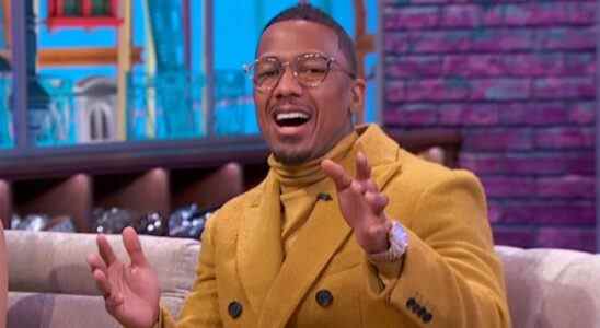 Nick Cannon wearing yellow jacket on talk show