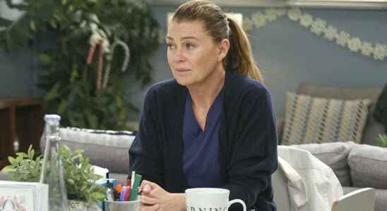 Meredith Grey sits at a desk on Grey