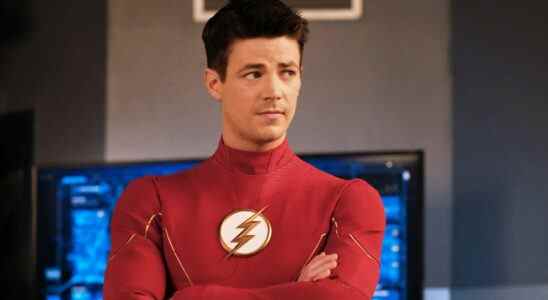 Grant Gustin wearing The Flash uniform without mask