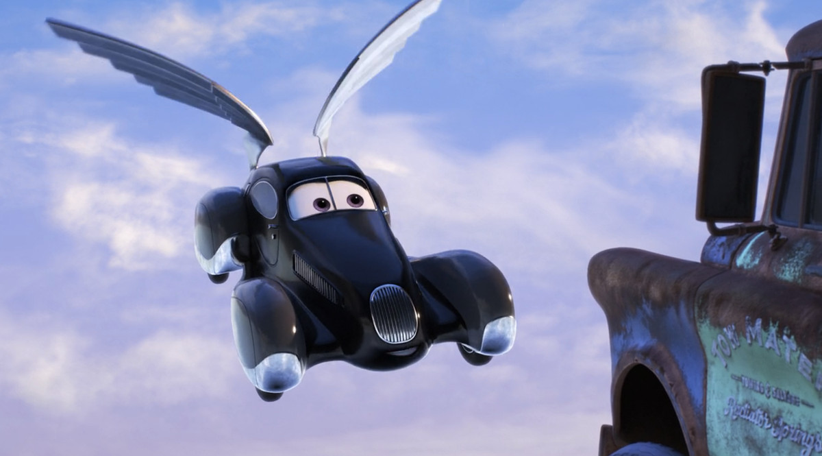 une voiture noire ressemblant à un corbillard avec des ailes flottant dans le ciel 