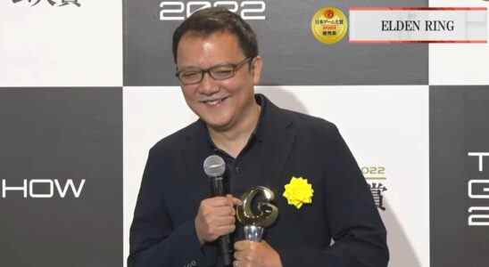 FromSoftware president Hidetaka Miyazaki smiles while holding Grand Award from the Tokyo Game Show