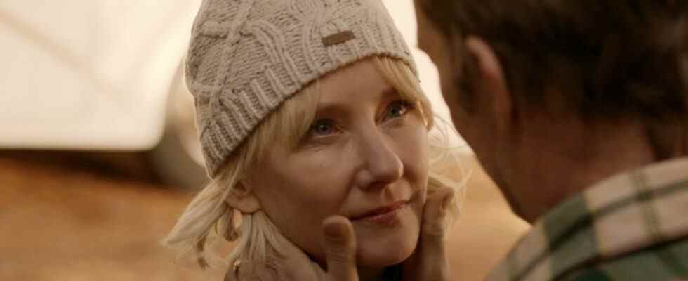 Anne Heche stands with a content look, while Thomas Jane holds her face in his hands in The Vanished.