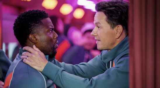 Kevin Hart and Mark Wahlberg looking at each other in Me Time
